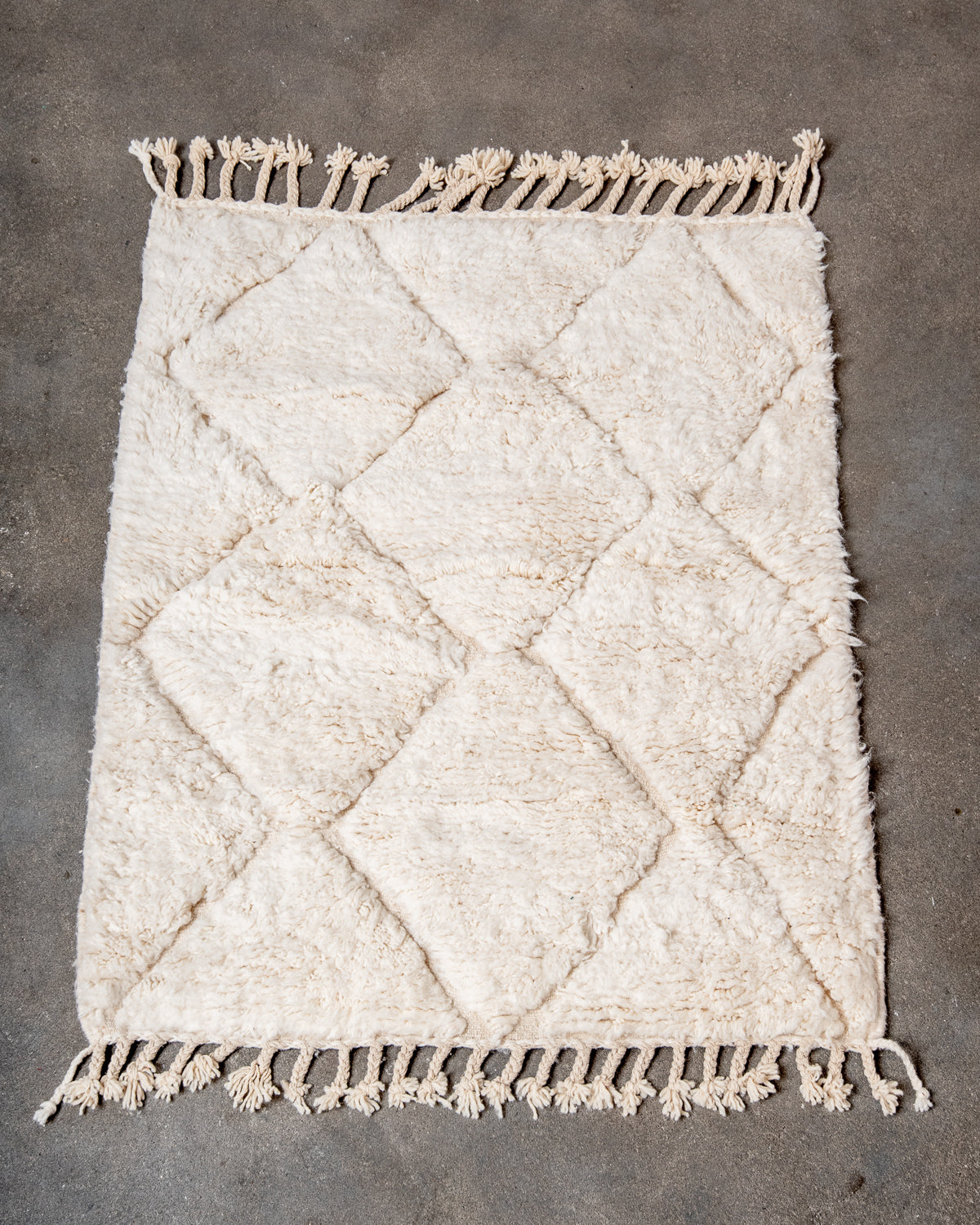 Modern, designer, handcrafted Berber rug from Morocco. Beniourain carpet with minimalist design, natural wool pile and a fluffy texture.